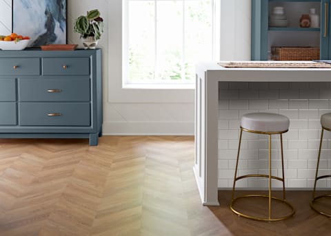 8mm Prospect Park Chevron Waterproof Laminate Flooring in butler's pantry with beige island with subway tile and blue cabinets