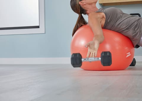 woman exercises on hybrid wood flooring