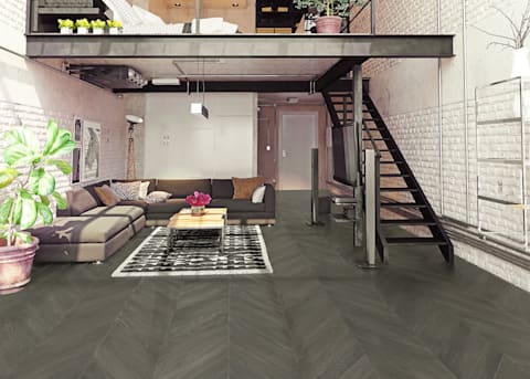 5/8 in x 11.5 in West Village Chevron Engineered Hardwood Flooring in loft with dark brown sectional sofa and bedroom with yellow flowers above in loft with metal stairs