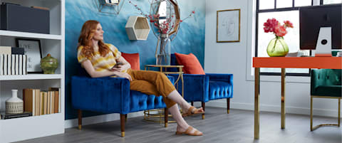 A woman enjoys a colorful, well designed space