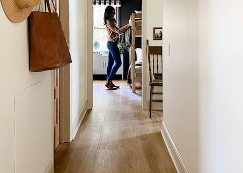7mm+Pad Bay Bridge Oak Hybrid Resilient Flooring with influencer Rignell Ranch in child bedroom with bunk beds and leather purse hanging on wall