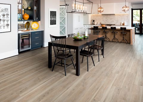 Dining room with wood look waterproof flooring.