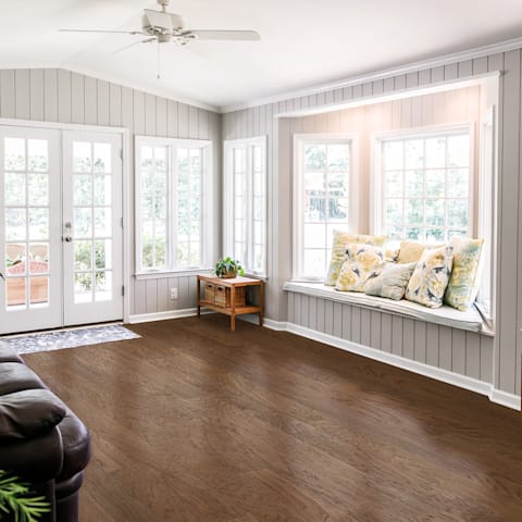 Gorgeous entryway with rich brown engineered hardwood, showing floor texture