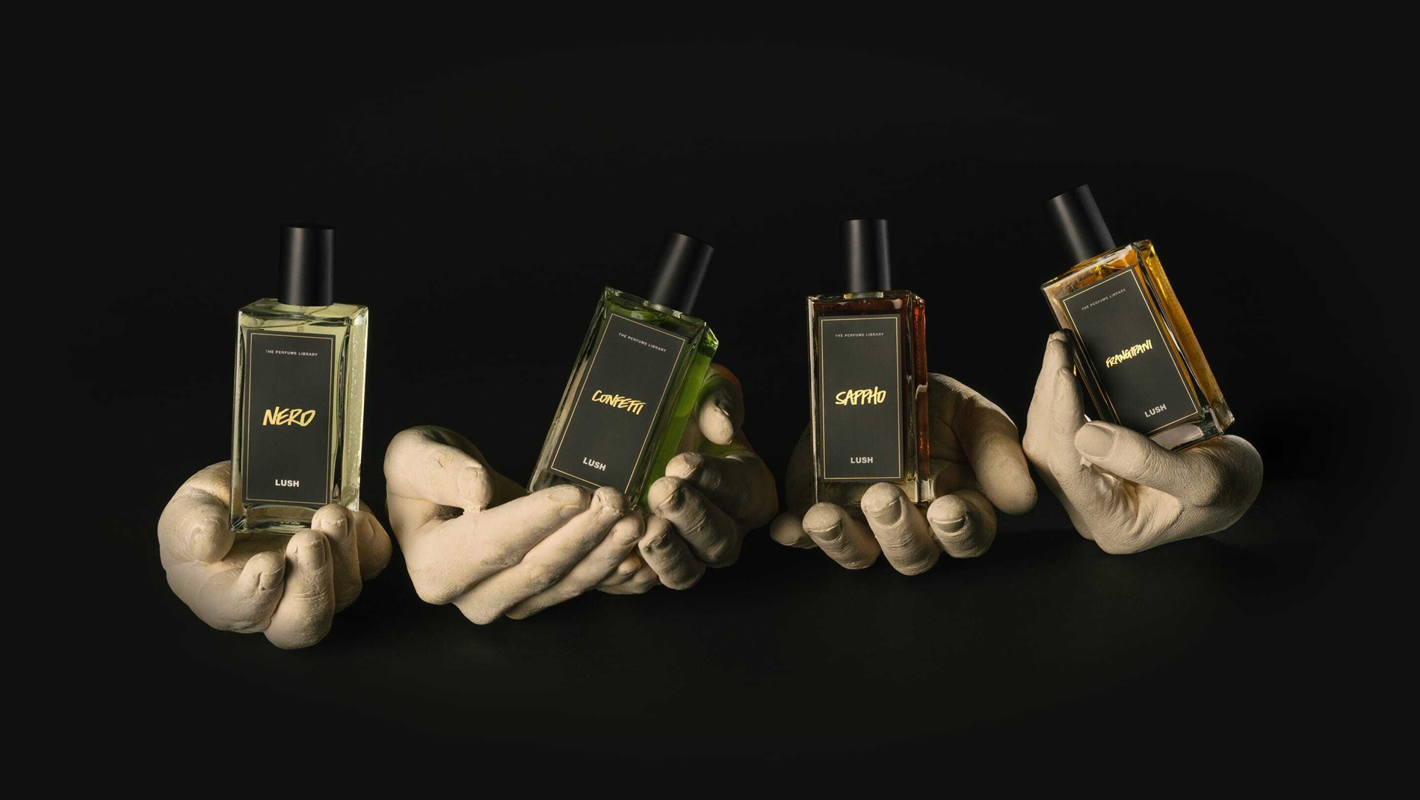 Perfume bottles cradled in hands