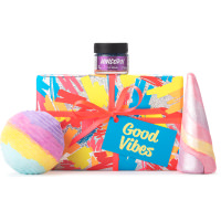 Good Vibes Gift multicoloured and glittery present with products on top and surrounding it