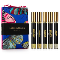 blue material perfume gift box with pink and blue butterfly design and perfumes displayed in front of it