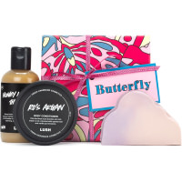 Butterfly Gift Set purple gift set with butterfly patterns and red ribbon with shower gel and soap on outside of the gift