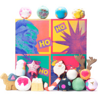 The Art Of Christmas Bathing Gift pop art style gift with pink and greyscale santa and a santa sleigh with lush products surrounding gift