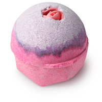pink and purple bath bomb with rose in the top