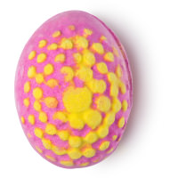 Which Came First Bath Bomb A pink bath bomb in the shape of a egg with yellow spots