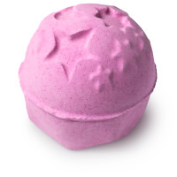 pink bath bomb with moon and stars shapes on top