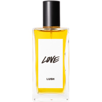 Lush 100ml Love Perfume A bottle of Love Lush perfume. The perfume is golden yellow in colour and contained in a rectangle bottle featuring a black lid and white label.