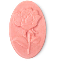 pink coloured oval shaped massage bar with rose design on it