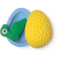blue and yellow egg shaped bath bomb with green dinosaur shaped fun product inside