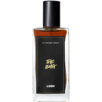 Lush 100ml The Bug Perfume A bottle of The Bug Lush perfume. The perfume is brown in colour and contained in a rectangle bottle featuring a black lid and label.