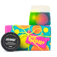 Glow Gift bright coloured circle patterned gift with products around it