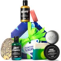 Northern Lights Gift dark blue polar bear themed gift box with products around it