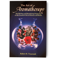 The Art of Aromatherapy By Robert B. Tisserand book cover with florals inside a glass jar