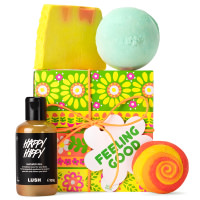 Feeling Good Gift green yellow and orange flower themed gift box with products around it
