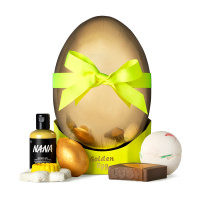 Golden Egg Gift golden egg shaped box surrounded by products that come inside the gift