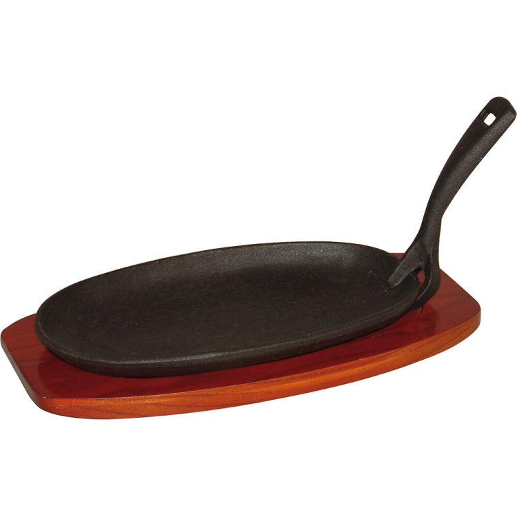 Poêle à servir en fonte avec dessous de plat en bois