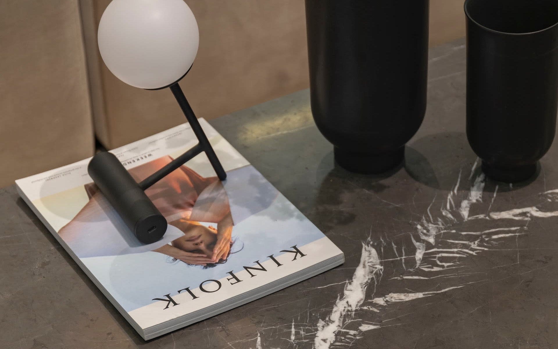 A magazine titled "KINFOLK" is sitting on a coffee table