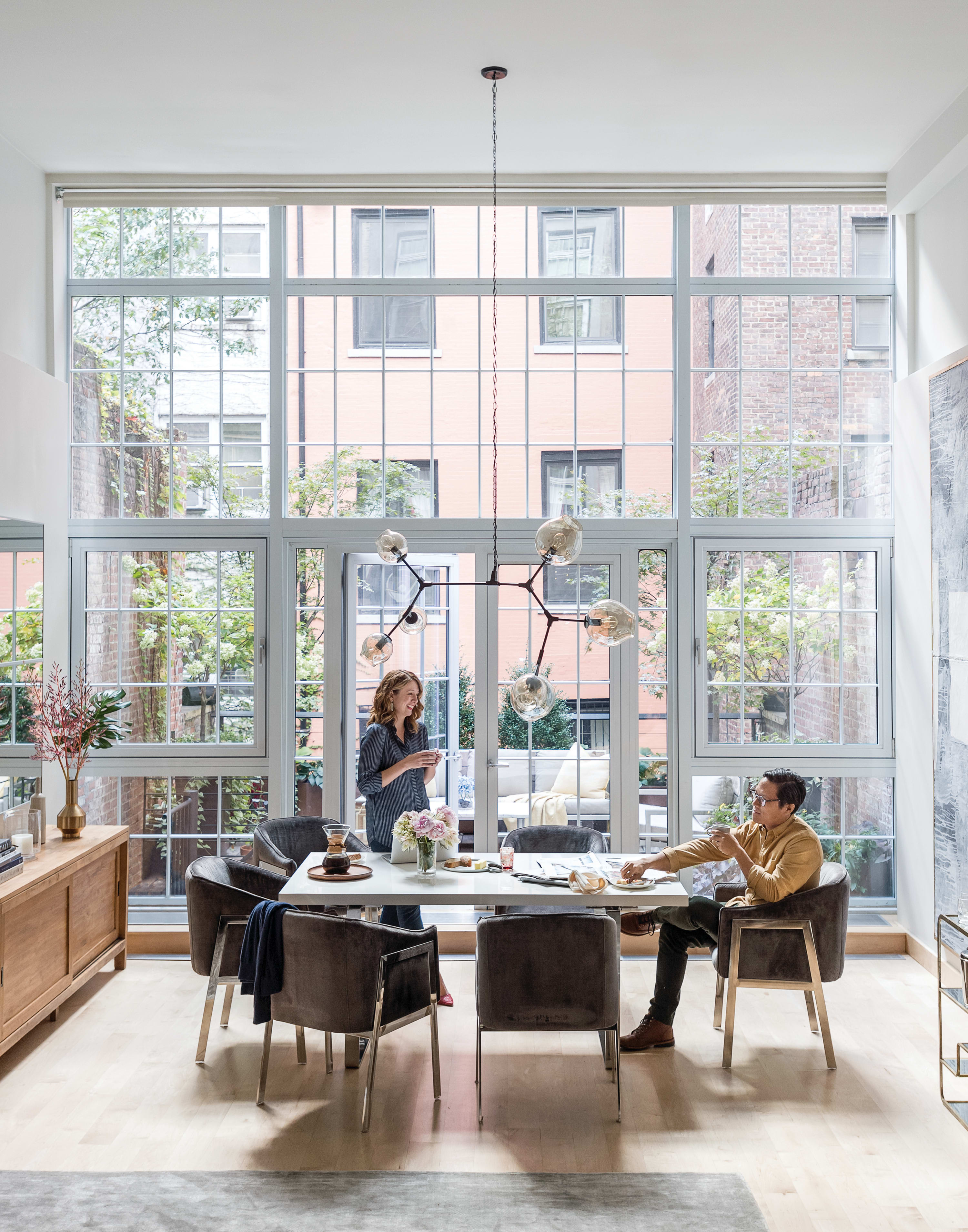 A modern dining with two people talking to each other.