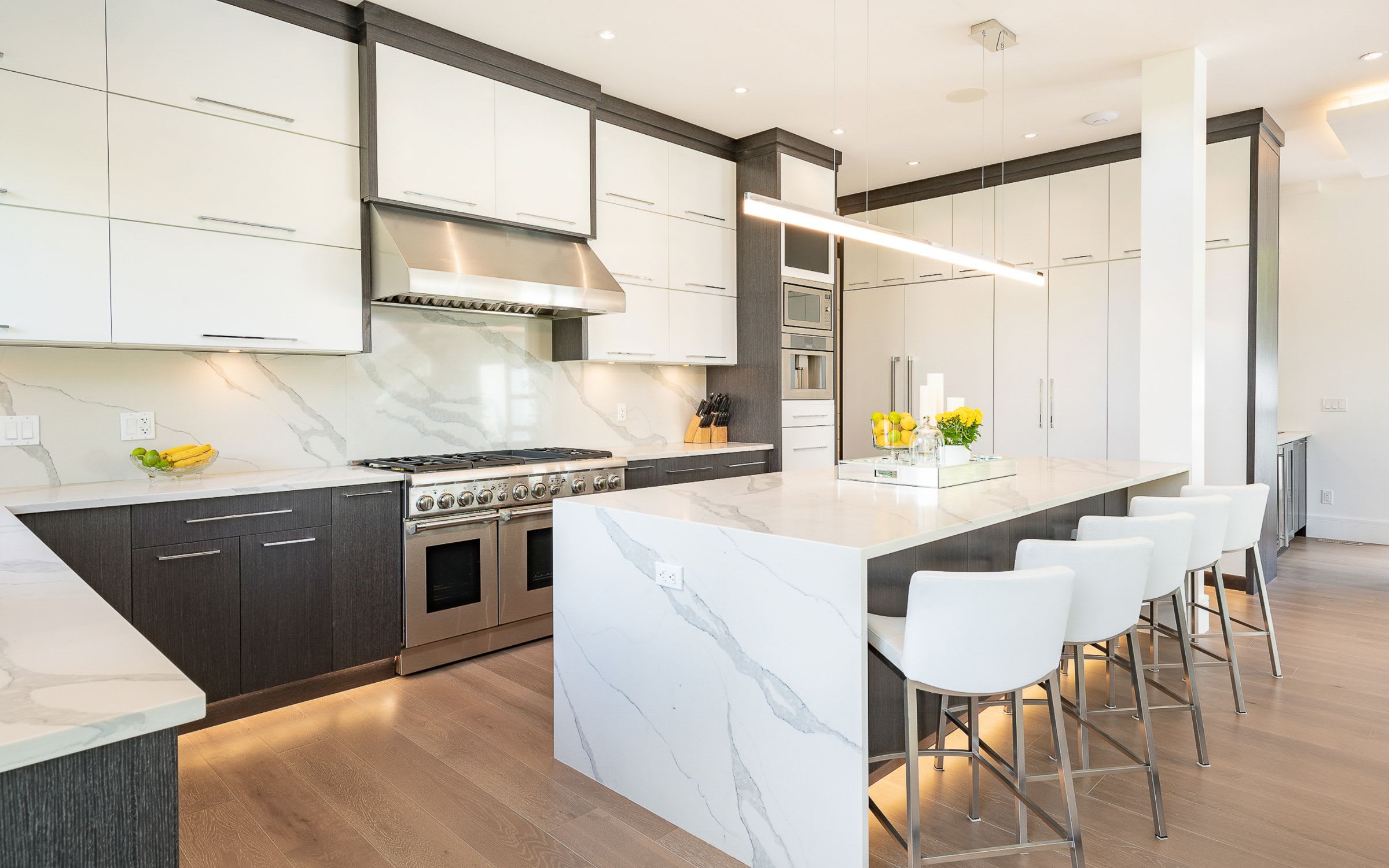 A modern kitchen with white and gray cabinets