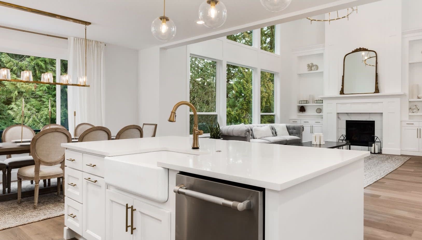 A modern kitchen with a stainless steel sink and dishwasher.