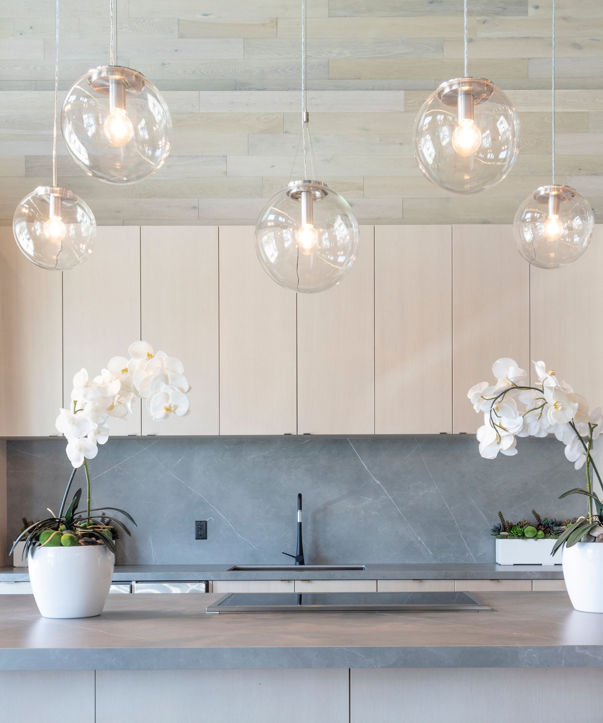 A kitchen with a sink and counter