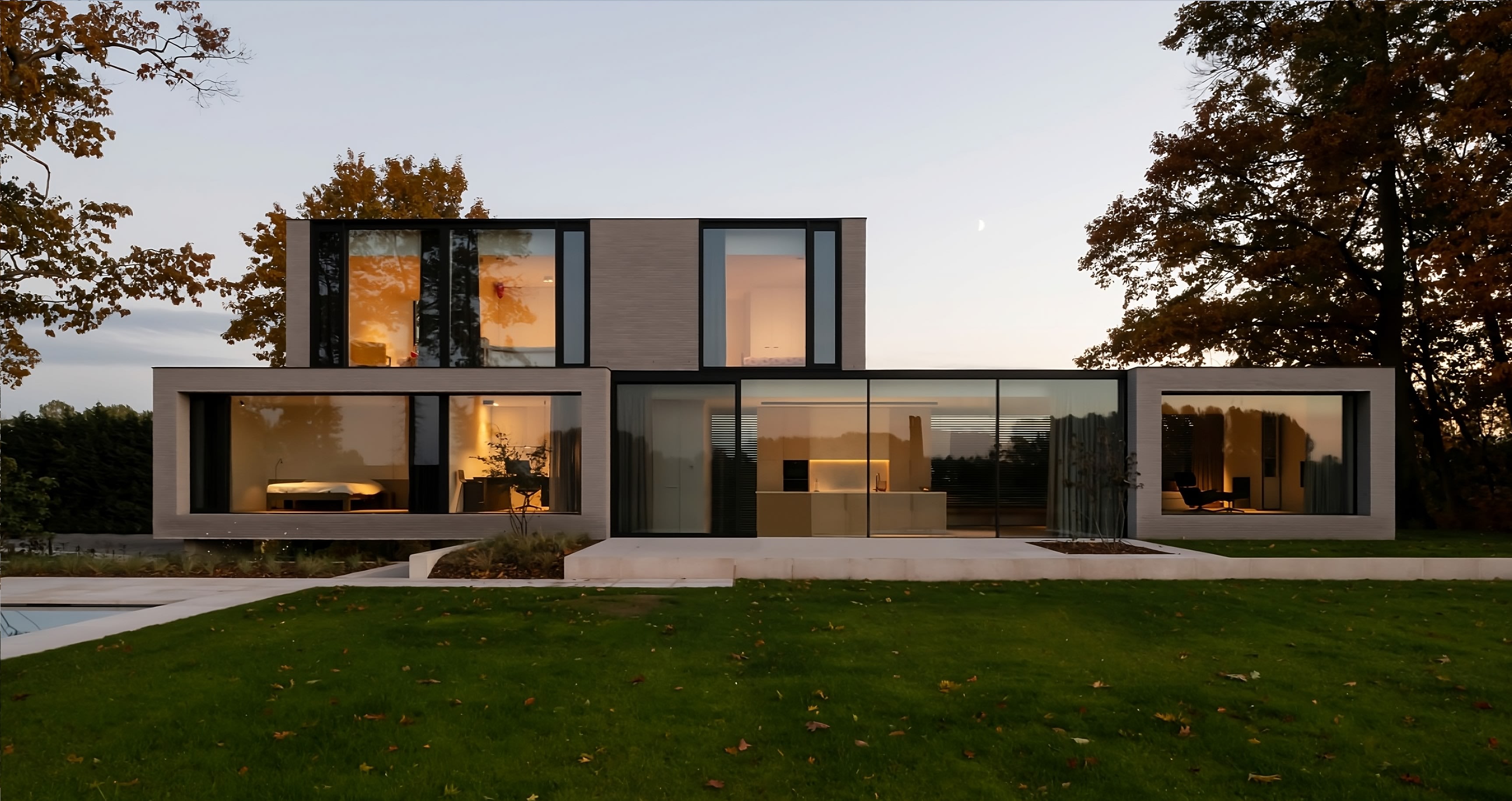 A modern house with large windows and a swimming pool in the backyard.