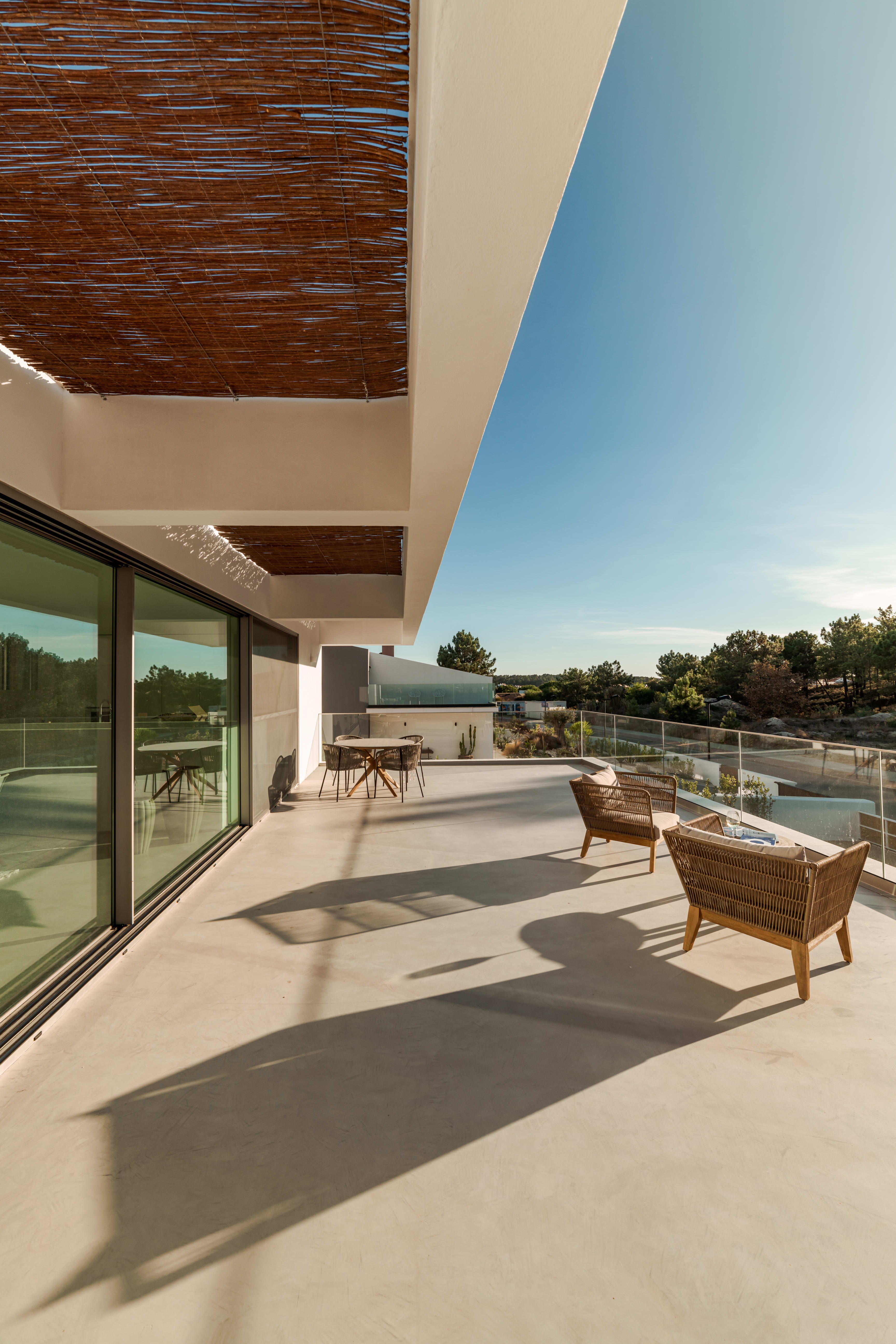 A patio with chairs and a table