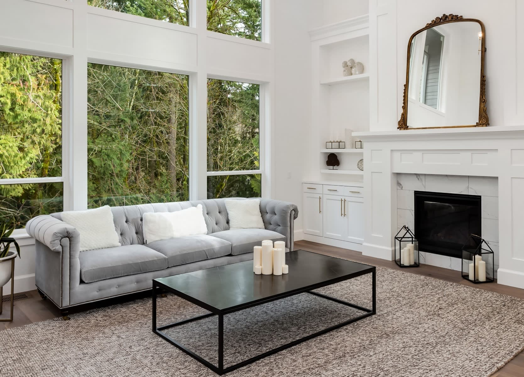 A living room with a fireplace, a couch, and a coffee table