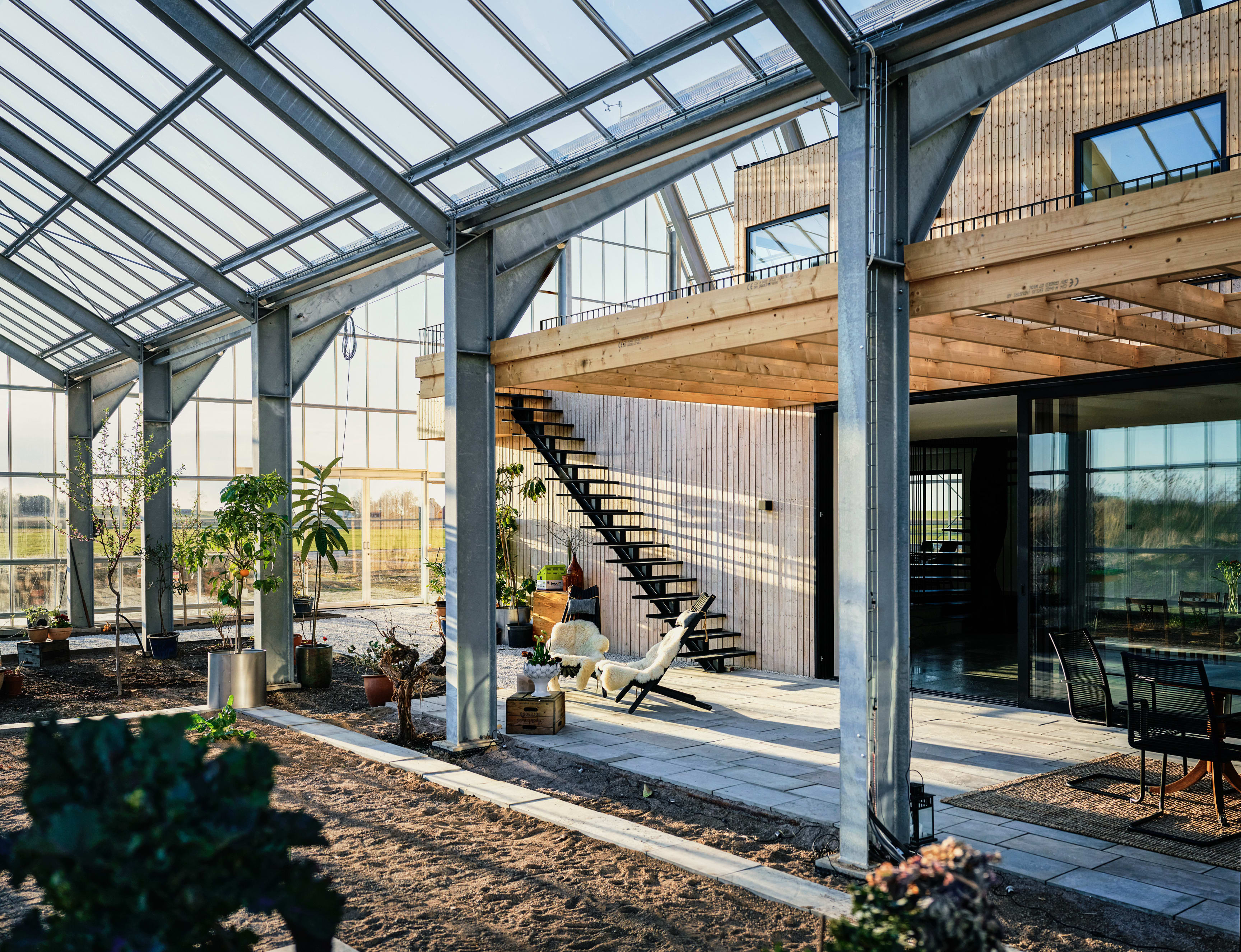 The core house is clad in wood from Swedish fir trees and was designed to be tall so as not to take up precious ground space. "We wanted the house to feel like it was in the garden," says Roja. 