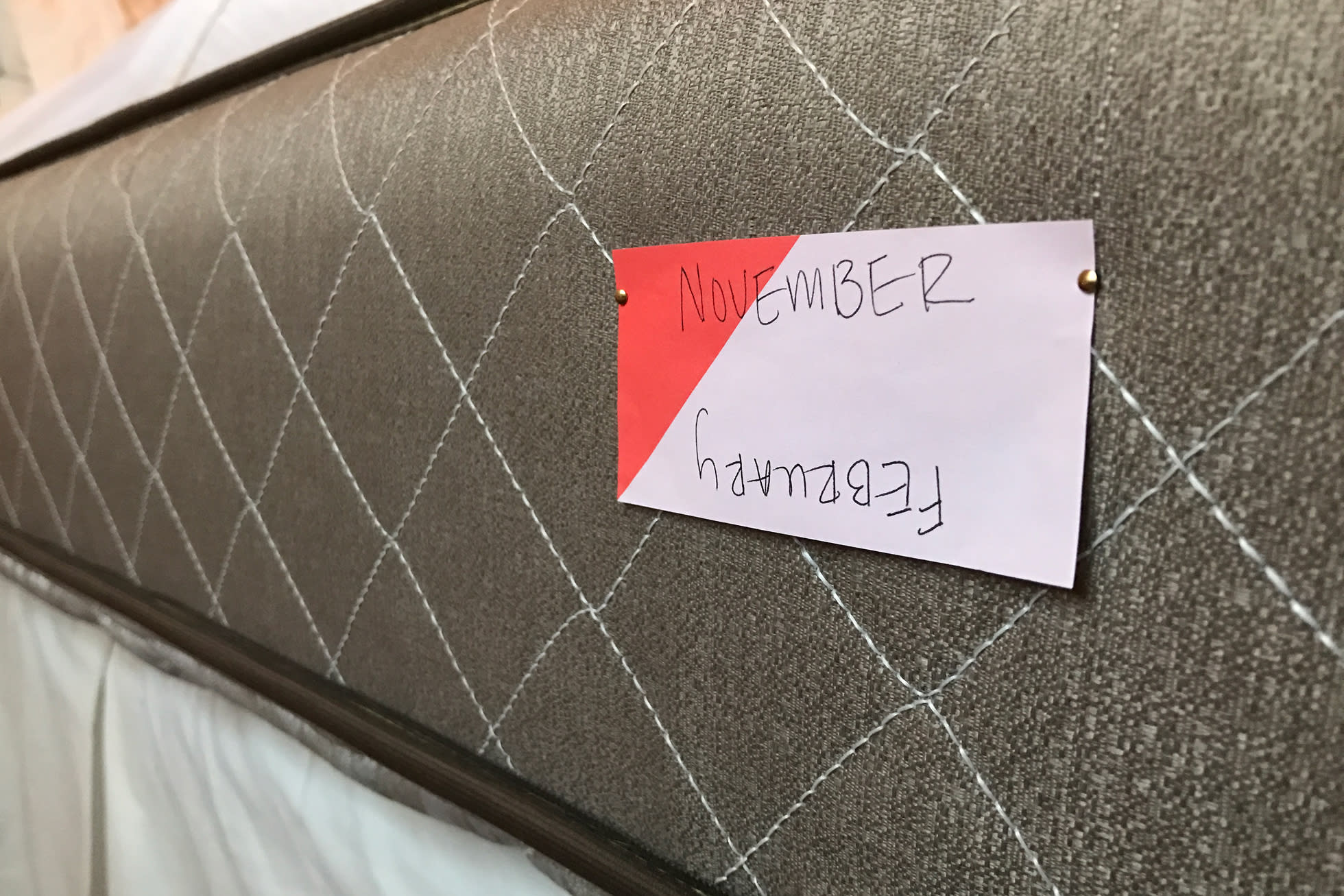 A pink note attached to a mattress