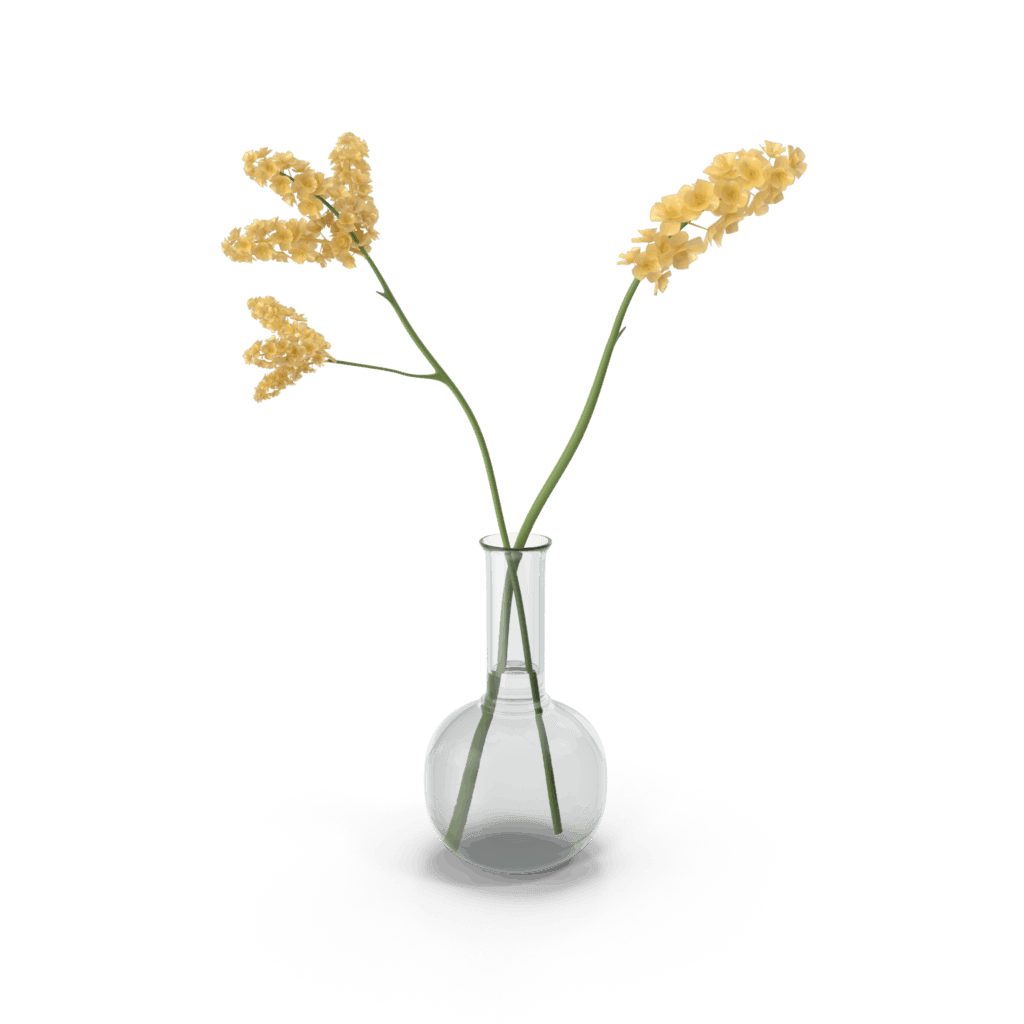 Yellow flowers in a clear glass vase against a green background.