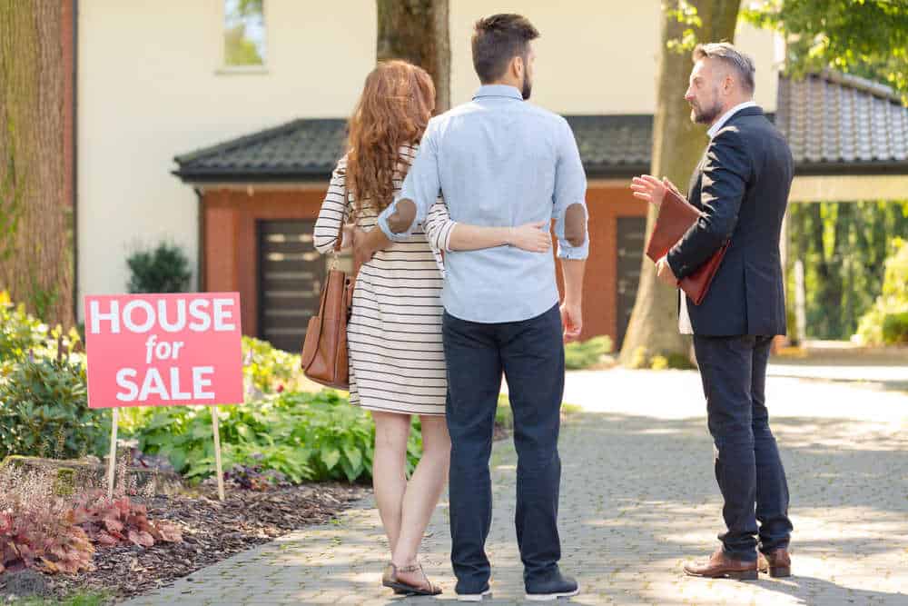 Couple Looking at House for sale (Helpful Tips for Selling Your House in 2022)