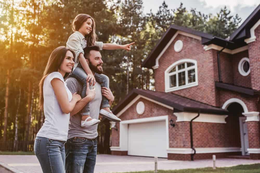 Family looking at house (5 Ways to Know if a House is Right for You)