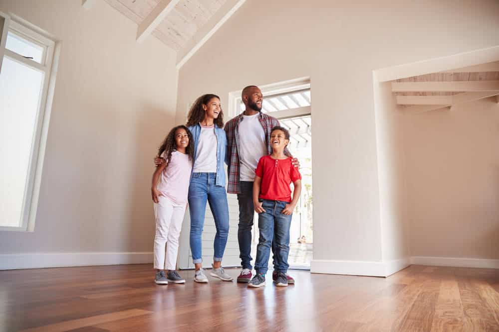 Family looking at their new house