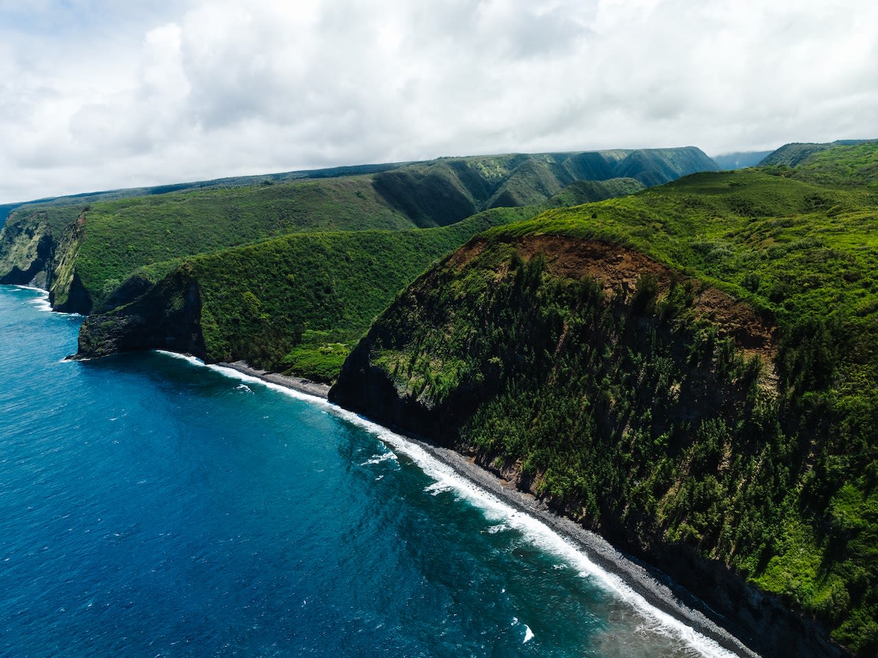 Northern cliffs at Halaula, beyond the Big Island Hawaii real estate for second homes and vacations from the San Francisco Bay Area.