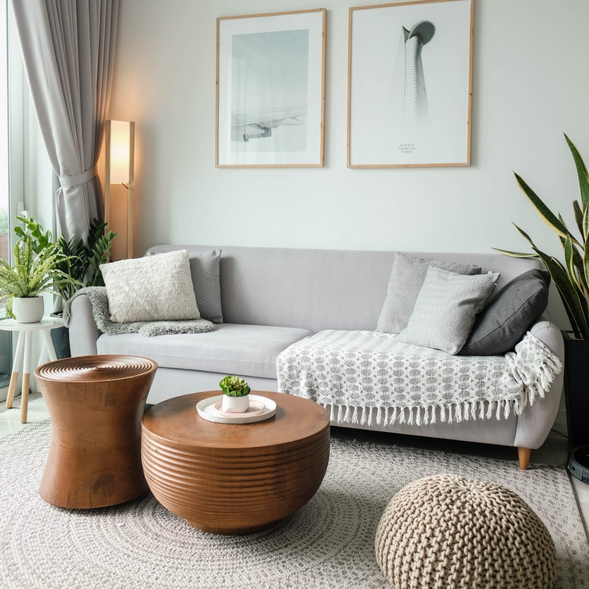 Grey Sofa with Pillows and a Brown Small Table