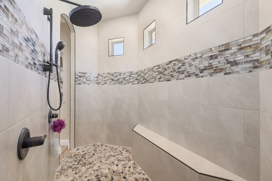 Large walkthrough shower with floor to ceiling tile