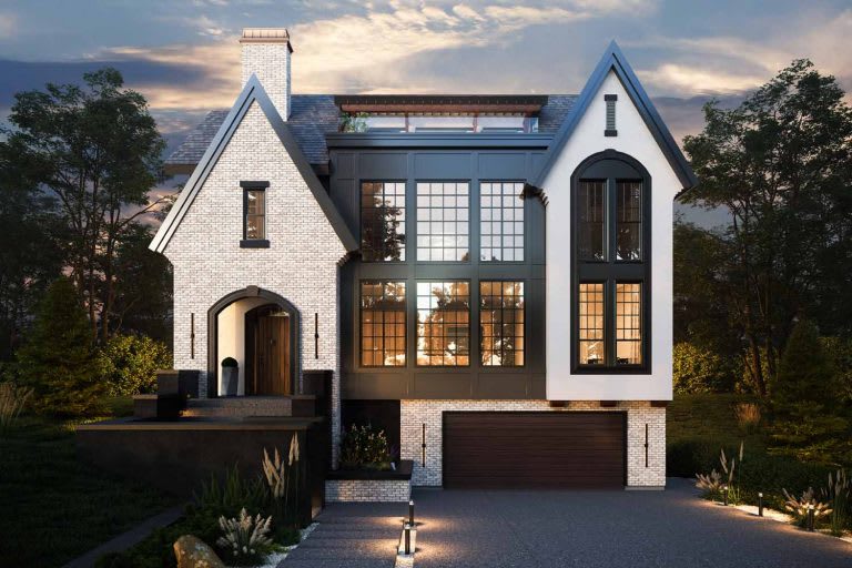A modern two-story house with large windows, a mix of brick and dark siding, and a landscaped front yard.