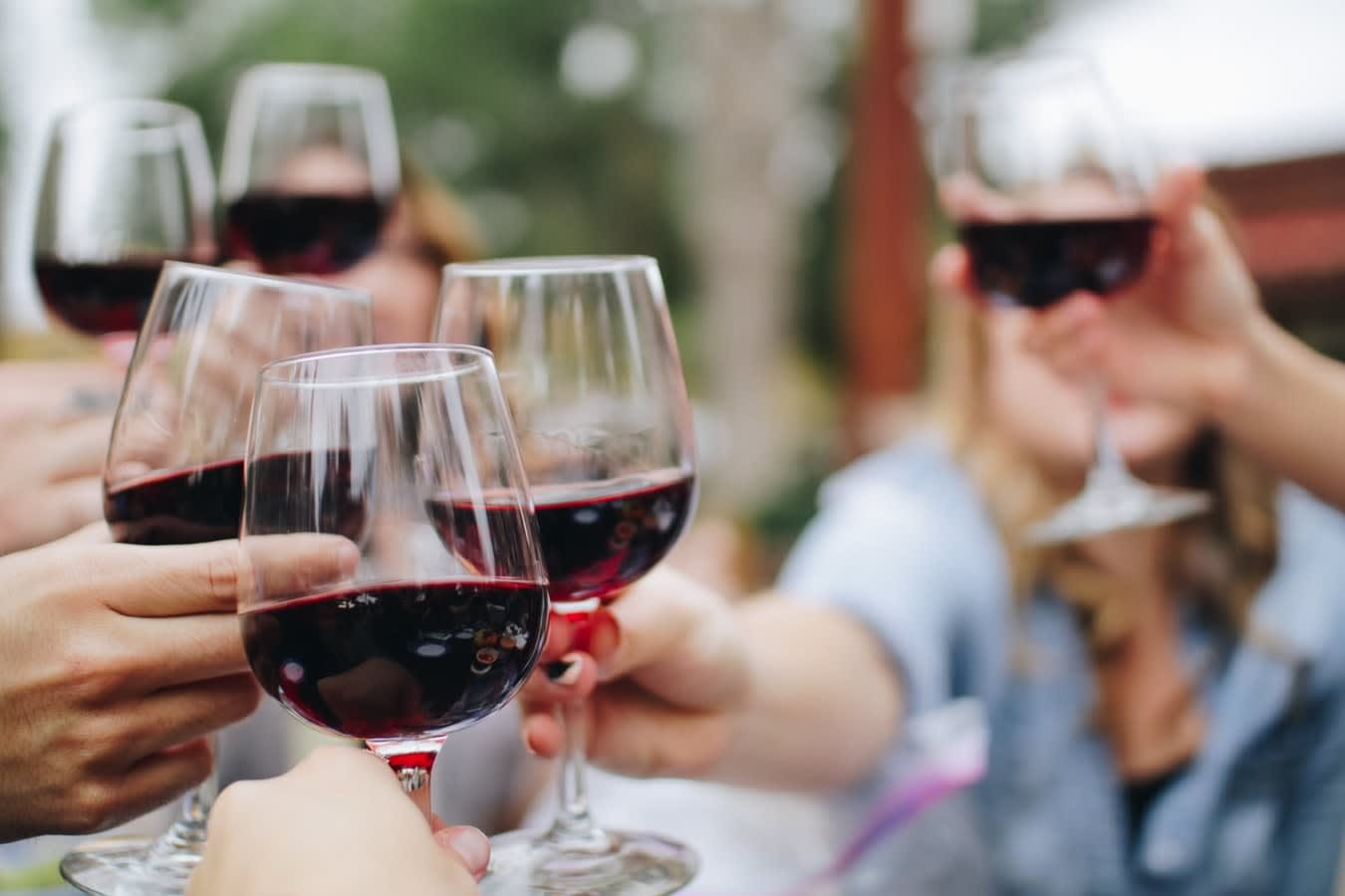 several glasses of red wine toasting for the San Diego fall festival