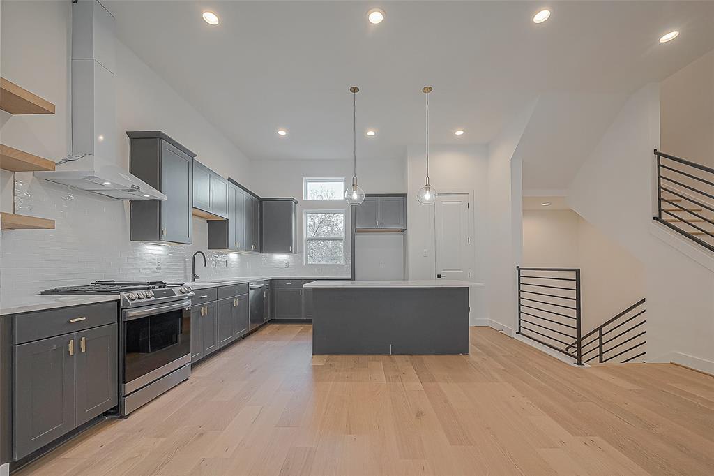 large kitchen with gray cabinets 