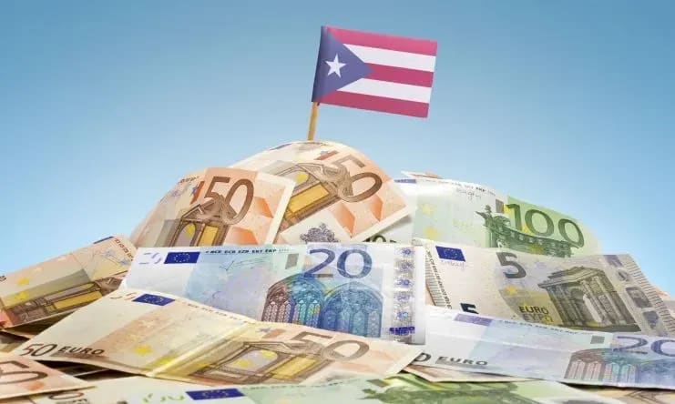 a pile of money with a flag on top