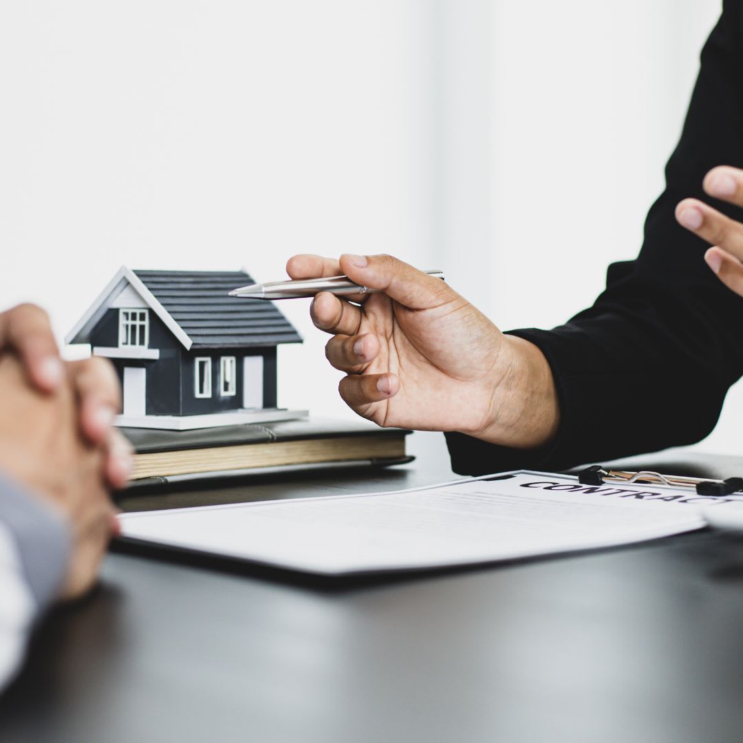 Real estate agent and client going over paperwork
