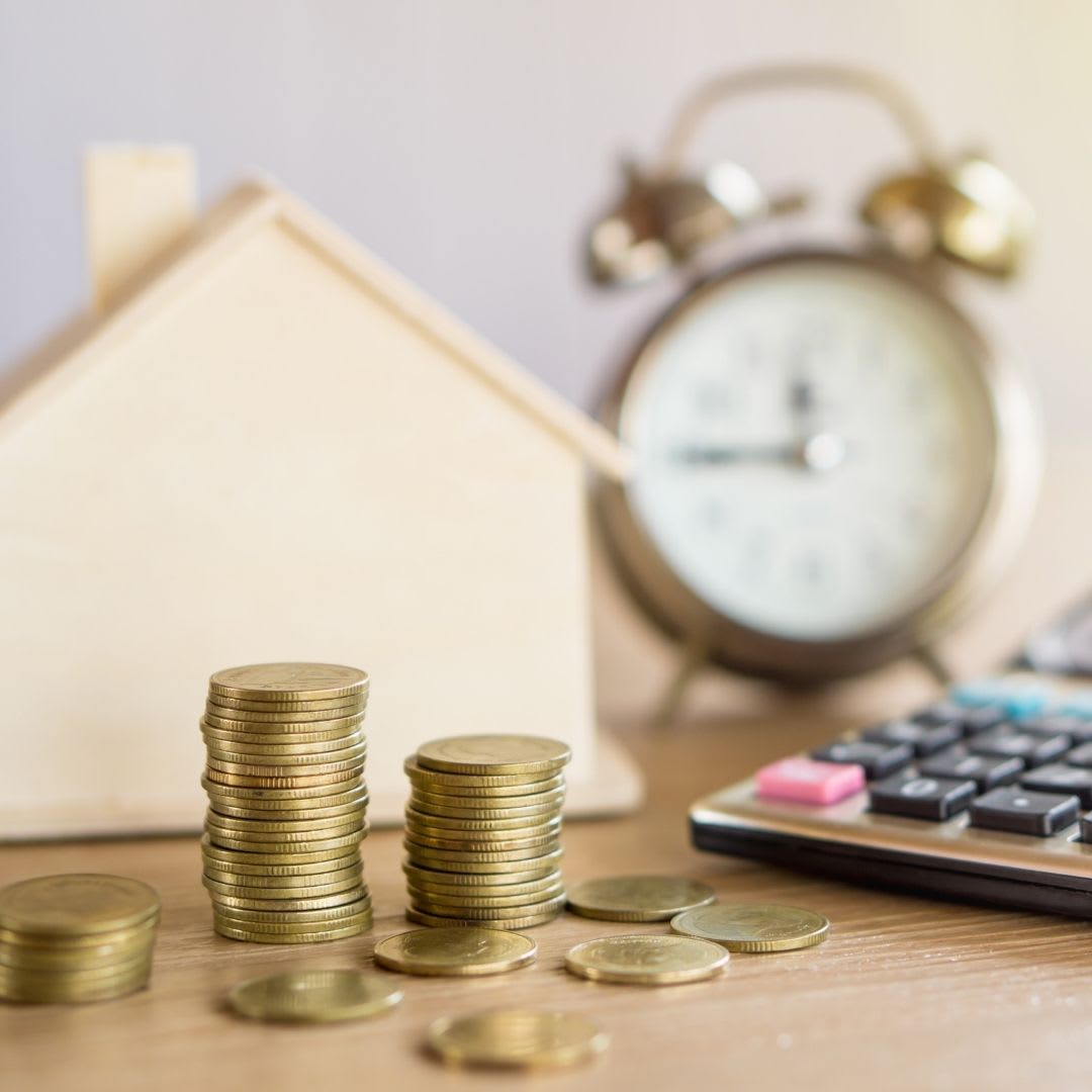 a clock, calculator, money, and a home
