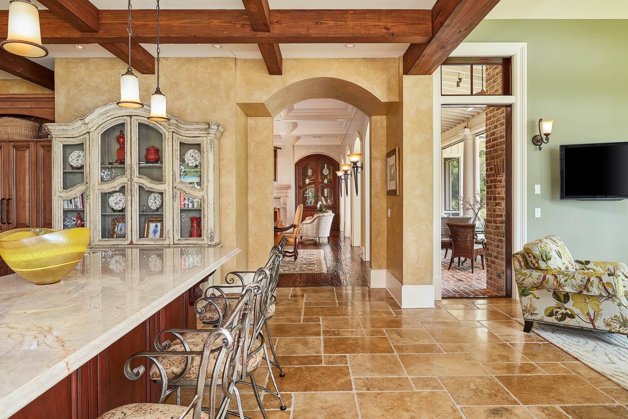 Kitchen area with island and bar chairs