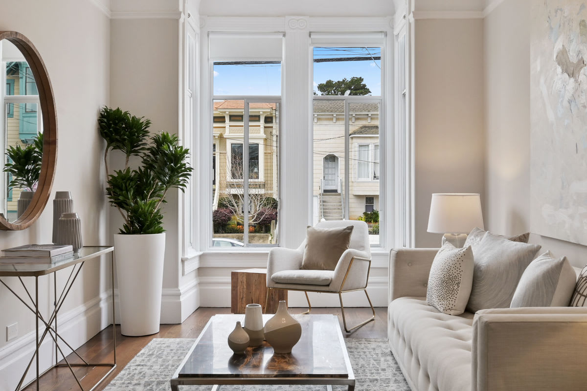 A staged living room at a Victorian condo real estate listing in Noe Valley.